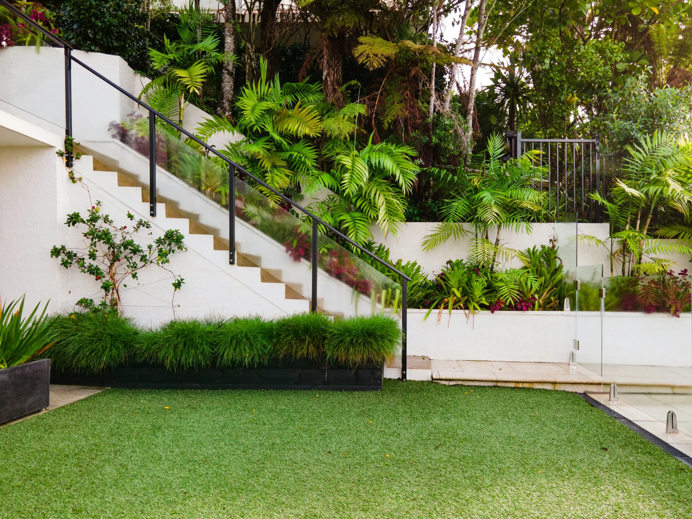 Landscaped residential yard finished with artificial turf