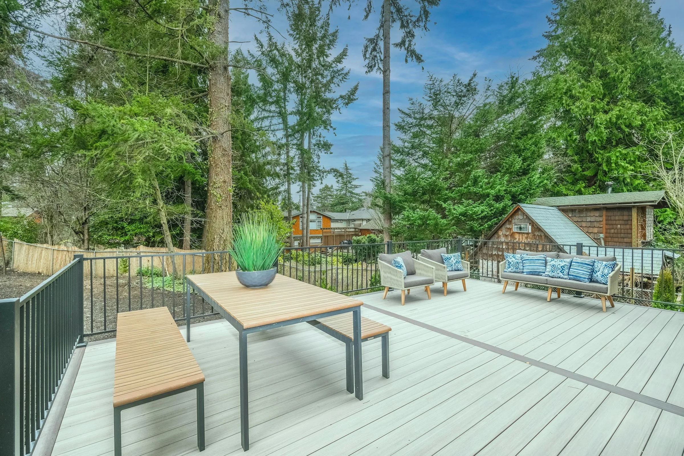 Contemporary composite deck furnished for outdoor living