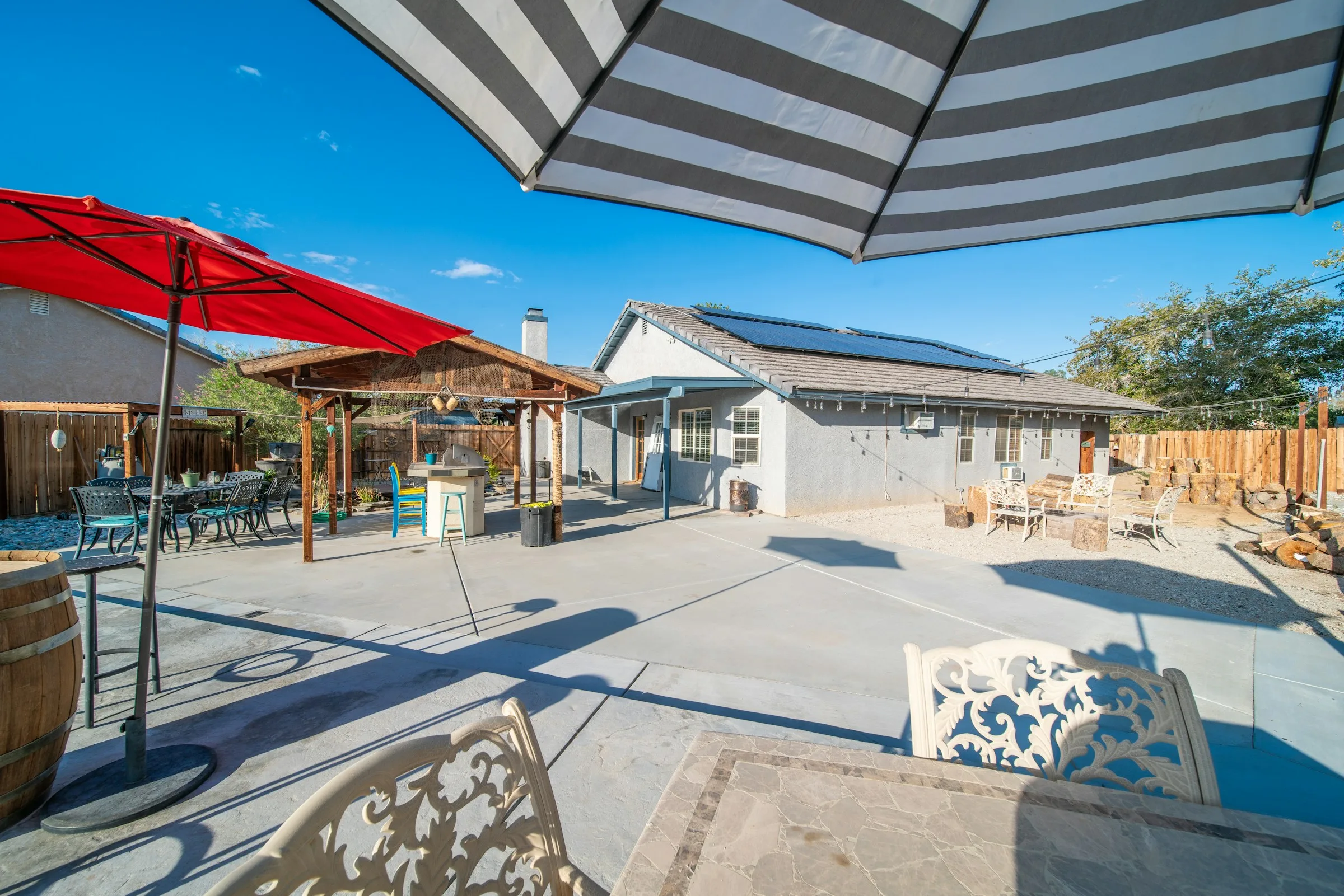 Paver courtyard surrounded by established garden planting