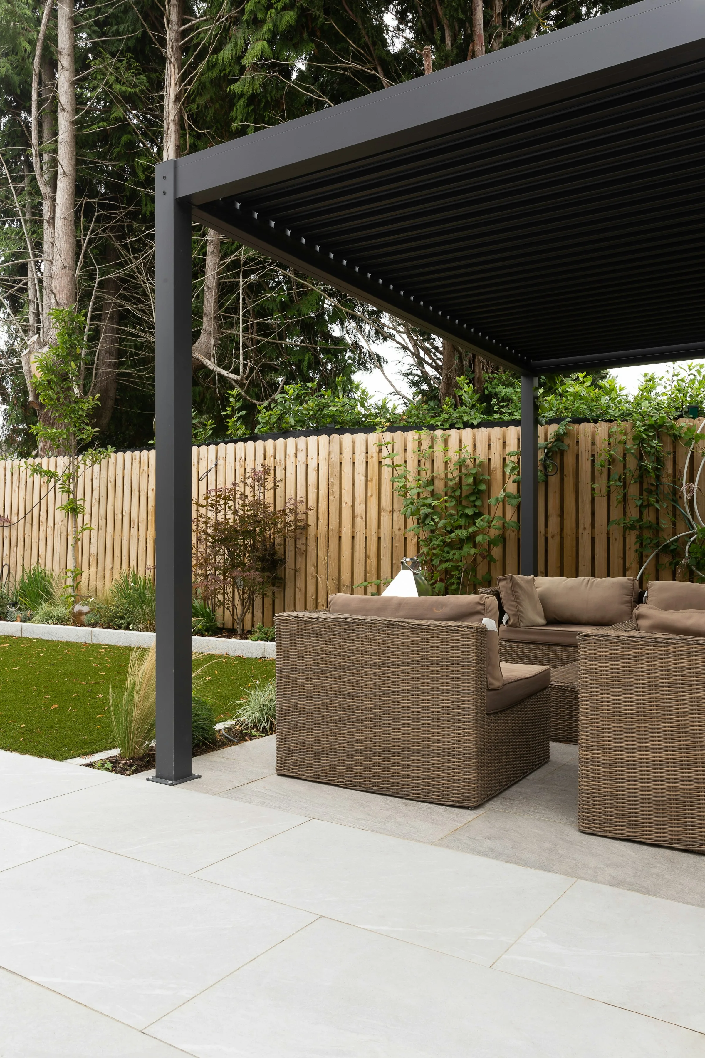 Comfortable outdoor seating beneath a modern pergola
